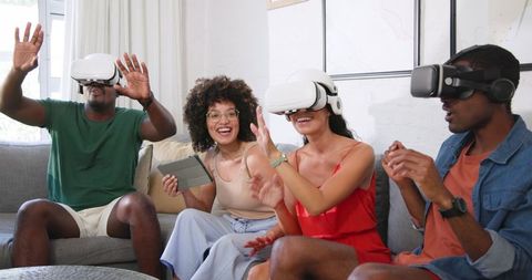 Friends Exploring Virtual Reality Together in Modern Living Room