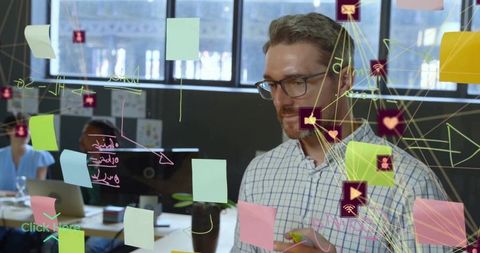 Professional enhancing workflow on transparent glass in office