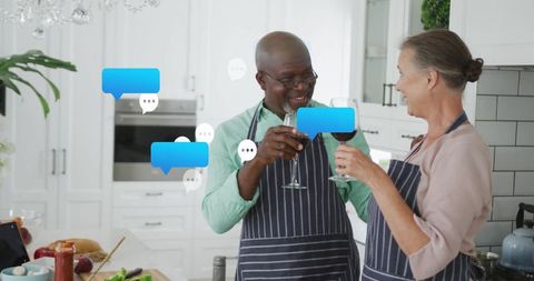 Senior Couple Toasting in Modern Kitchen with Chat Message Overlay