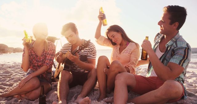 Young Friends Enjoying Beach Party with Live Guitar Music at Sunset - Download Free Stock Images Pikwizard.com