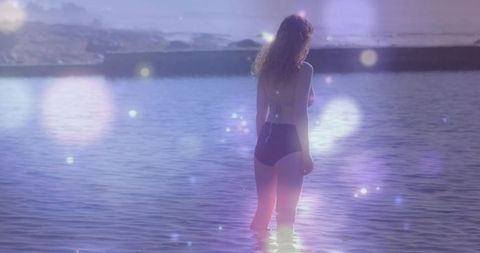 Serene woman enjoys tranquil morning in calm coastal waters