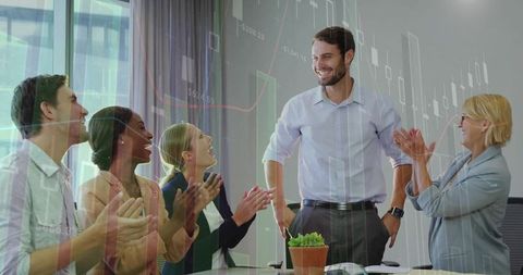Successful Team Celebrating Achievement in Modern Conference Room
