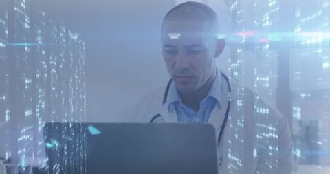 Doctor Using Laptop in High-Tech Medical Environment