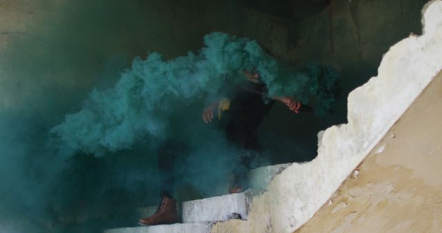 Person Moving Through Staircase with Colorful Smoke in Abandoned Building - Download Free Stock Images Pikwizard.com