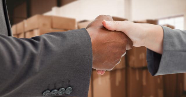 Close-up of business people shaking hands in warehouse - Download Free Stock Photos Pikwizard.com