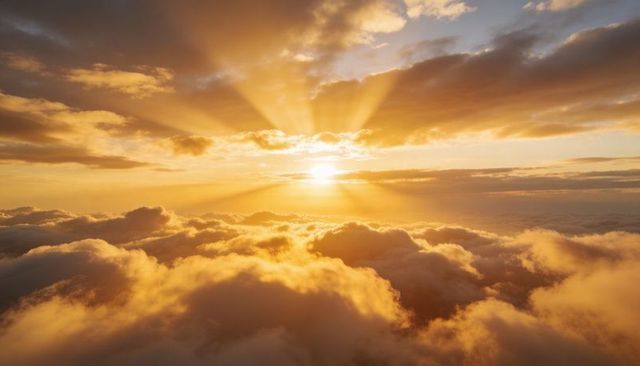 Sunrise casting golden crepuscular rays over dramatic cumulus cloudscape