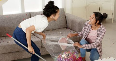 Women Cleaning Confetti after Party, Celebrating Friendship and Teamwork