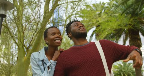 Couple Enjoying Nature and Sharing Joyful Moment