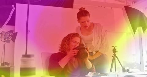 Professional Photographers Collaborating in Modern Studio Space