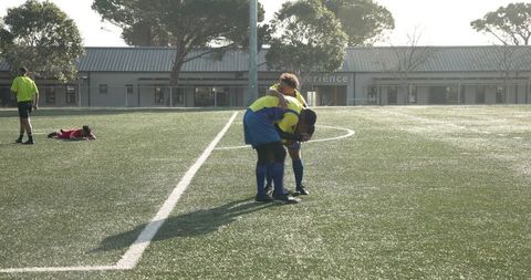 Soccer Players in Yellow Jerseys During Outdoor Practice Session