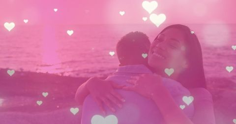 Romantic Couple Embracing at Sunset with Heart Overlay