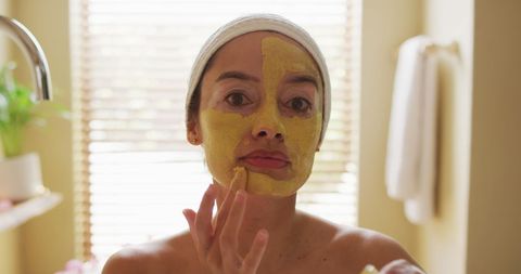 Woman Applying Nourishing Face Mask in Bathroom Serenity - Download Free Stock Images Pikwizard.com