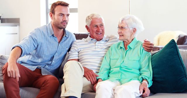 Happy Family Generations Relaxing on a Couch at Home - Download Free Stock Images Pikwizard.com