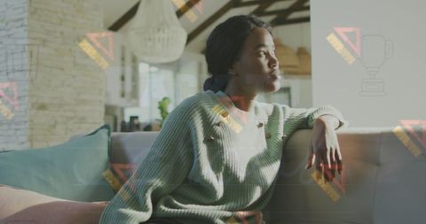 Serene Woman Daydreaming by Bright Window on Sofa