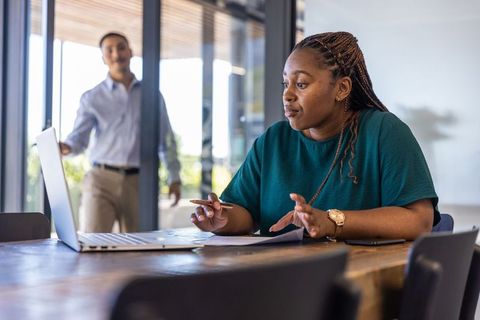 Diverse coworkers collaborating in modern work environment
