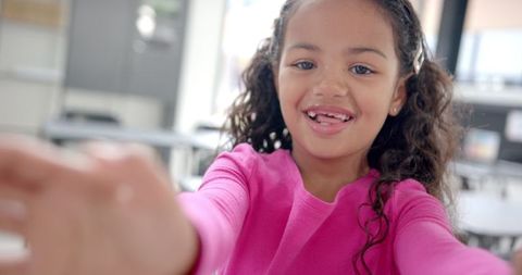 Joyful Young Girl Smiling in Classroom Learning Environment - Download Free Stock Images Pikwizard.com