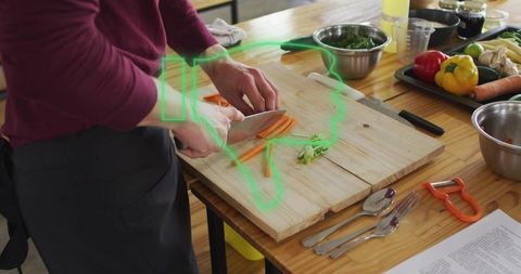Chef Preparing Fresh Vegetables at a Rustic Kitchen Table