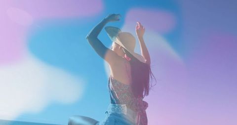 Bohemian Woman in Sun Hat Enjoying Coastal View