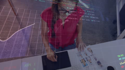 Overlay of Financial Data and Woman Using Tablet