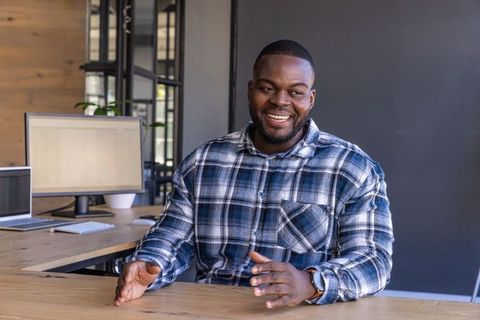 Confident Professional Discussing Ideas at Modern Workspace