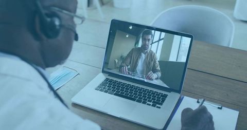 Senior Doctor Consulting Patient through Virtual Appointment