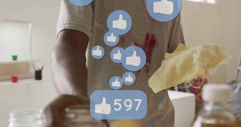 Artist cleaning studio counter as social media engagement grows