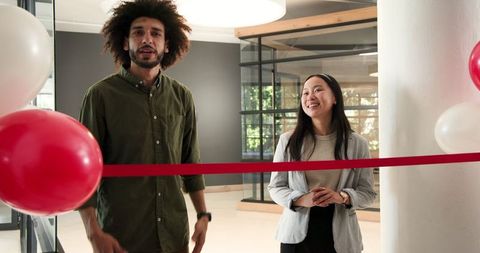 Business professionals celebrating office opening ceremony