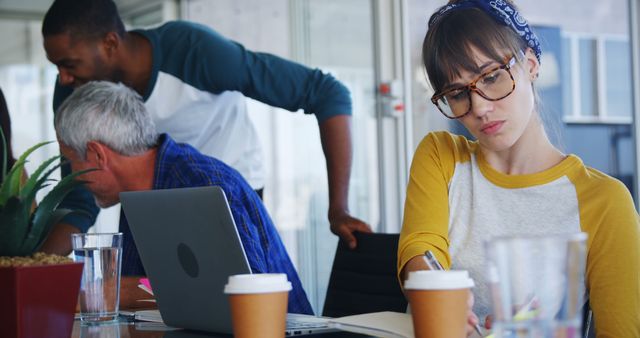 Creative Team Brainstorming in Modern Office, Focus on Thoughtful Young Woman - Download Free Stock Images Pikwizard.com