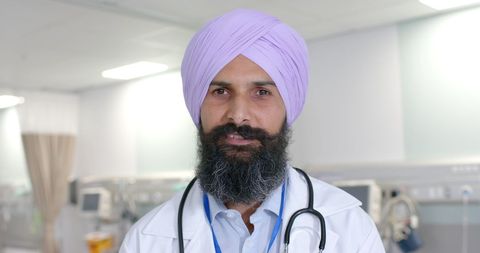 Confident sikh doctor wearing turban in hospital setting