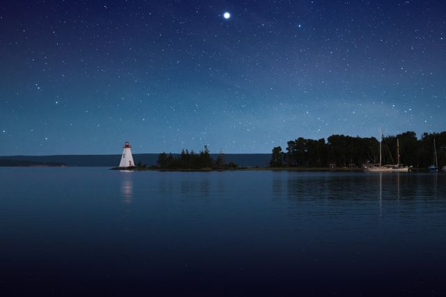 Tranquil Night Sky Over Lake and Lighthouse - Download Free Stock Images Pikwizard.com