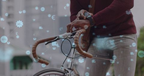 Digital Icons Overlay with Man and Bicycle in Urban Setting