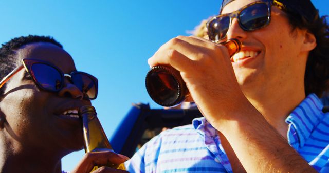 Friends Enjoying Cold Beers Outdoors on a Sunny Day - Download Free Stock Images Pikwizard.com