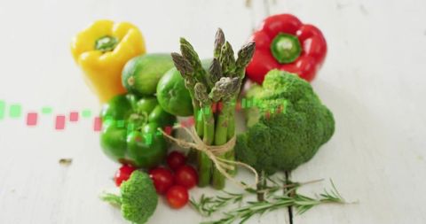 Fresh Asparagus Bundle with Colorful Vegetables and Candlestick Chart Overlay