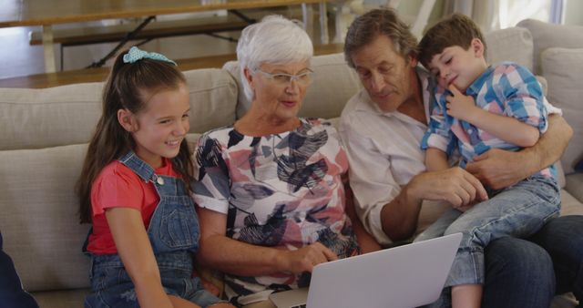 Grandparents Spending Quality Time with Grandchildren Using Laptop - Download Free Stock Images Pikwizard.com