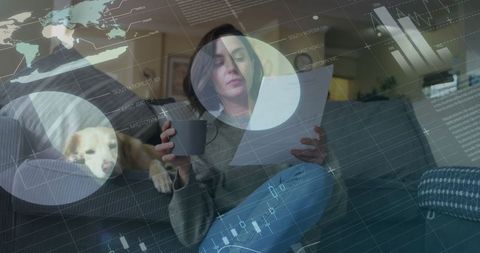 Business Professional Analyzing Data in Home Office with Dog