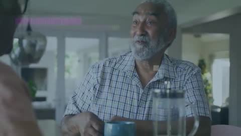 Senior man smiling and holding mug while reminiscing with partner, health data graphics overlay