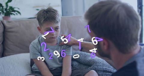 Father comforting son on couch with numeric overlay representing emotional support