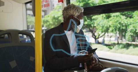 Masked Man Commuting on Bus with Digital Thumbs-Up
