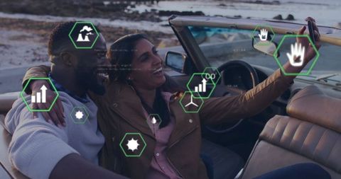 Couple in Convertible Taking Selfie with Graphic Overlays at Beach