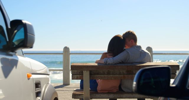 Couple Embracing on Beachfront Bench with Ocean View - Download Free Stock Images Pikwizard.com