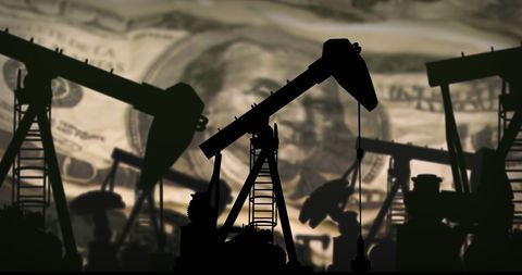 Silhouette of Oil Pumpjacks Against US Dollar Background - Download Free Stock Images Pikwizard.com