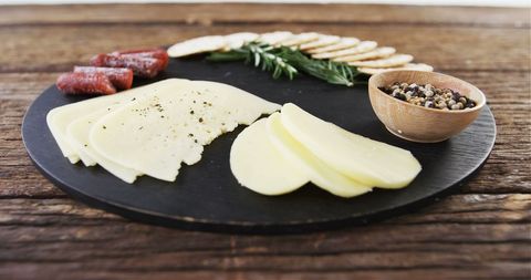 Gourmet Cheese and Charcuterie Board with Crackers and Herb Garnish - Download Free Stock Images Pikwizard.com