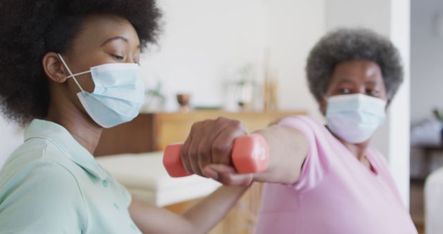 Physiotherapist Helping Senior Woman with Exercise During Pandemic - Download Free Stock Images Pikwizard.com