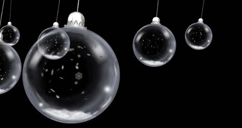 Elegant Glass Ornaments on Black Background