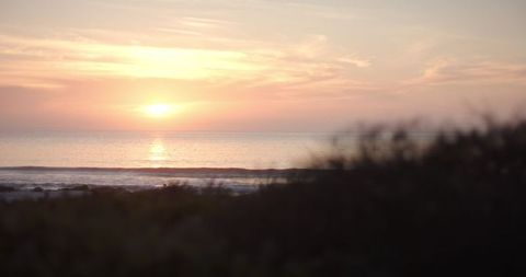 Serene Ocean Sunset with Glowing Horizon