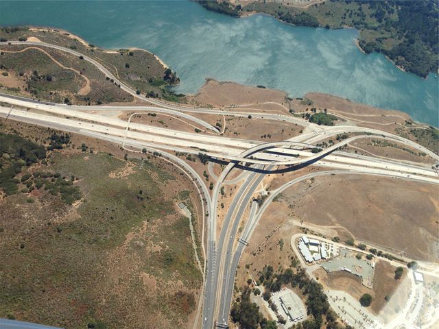 Aerial View of Highway Interchange Near Waterfront - Download Free Stock Photos Pikwizard.com