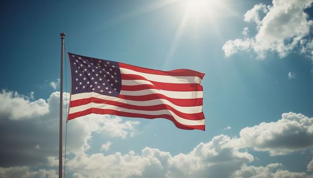 Waving american flag radiant under sunlit clouds