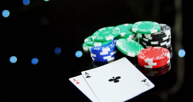 Playing cards and casino chips on poker table in casino