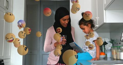 Mother and Daughter Bonding in Kitchen with Book and Glass of Water