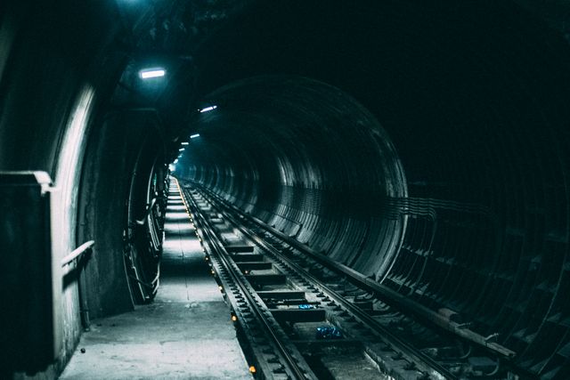 Ideal for illustrating themes of mystery, urban exploration, and transportation. Suitable for use in marketing for thriller movies, urban development presentations, or any project related to underground transit systems.